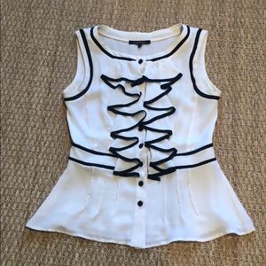 Tuxedo style ruffled sleeveless blouse